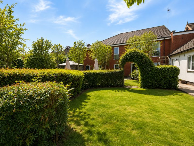 Landscaped garden lawn at Burleigh House care home, Baldock